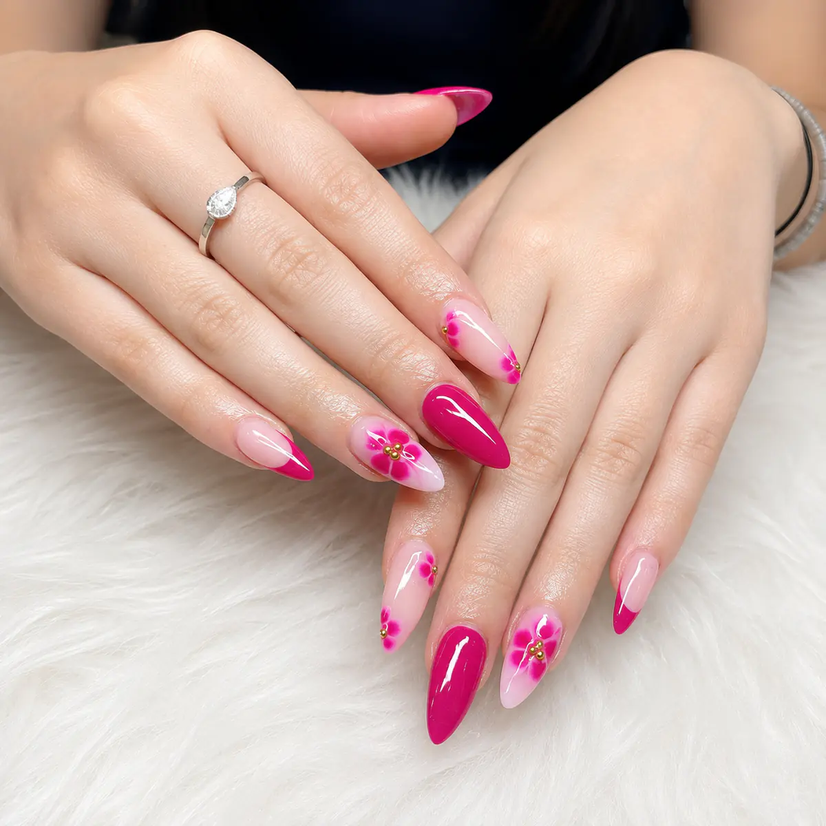 Pink floral almond nail art created at Top Ten Nails Spa in Vernon, BC
